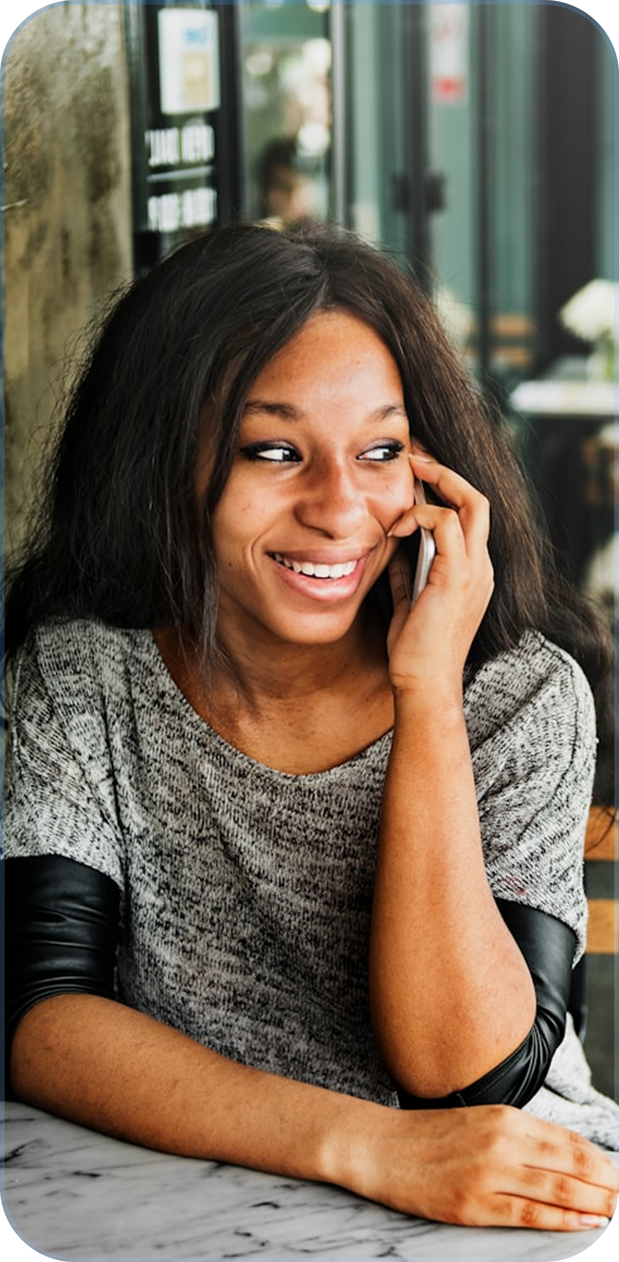 Illustration showing a person working on a laptop with various telecom icons around them