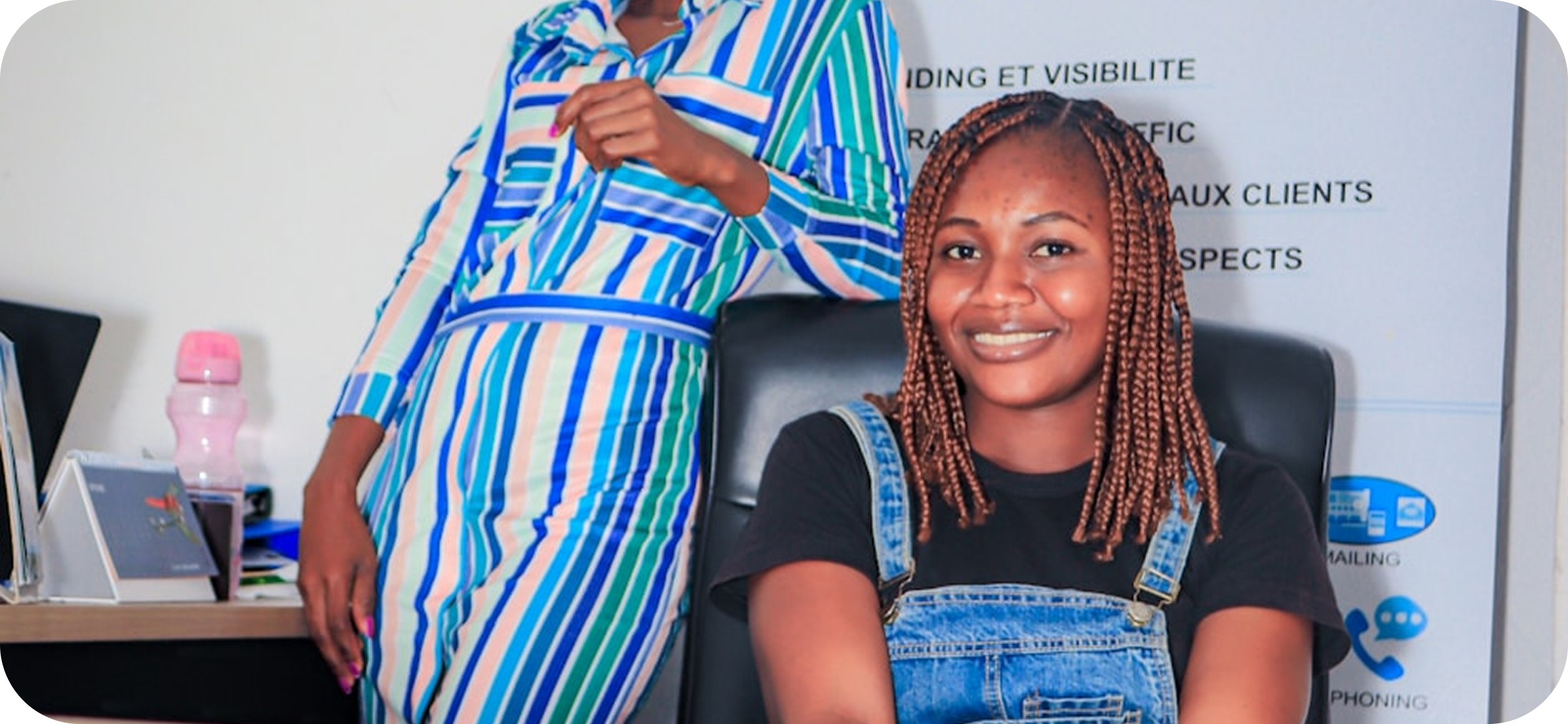 Illustration showing a person working on a laptop with various telecom icons around them